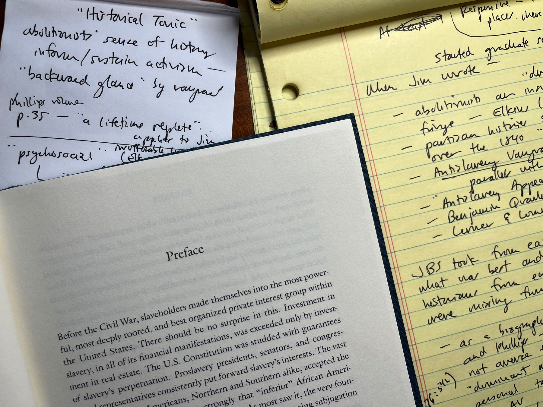 Photograph of handwritten notes and a page from the preface of a book by Jim Stewart