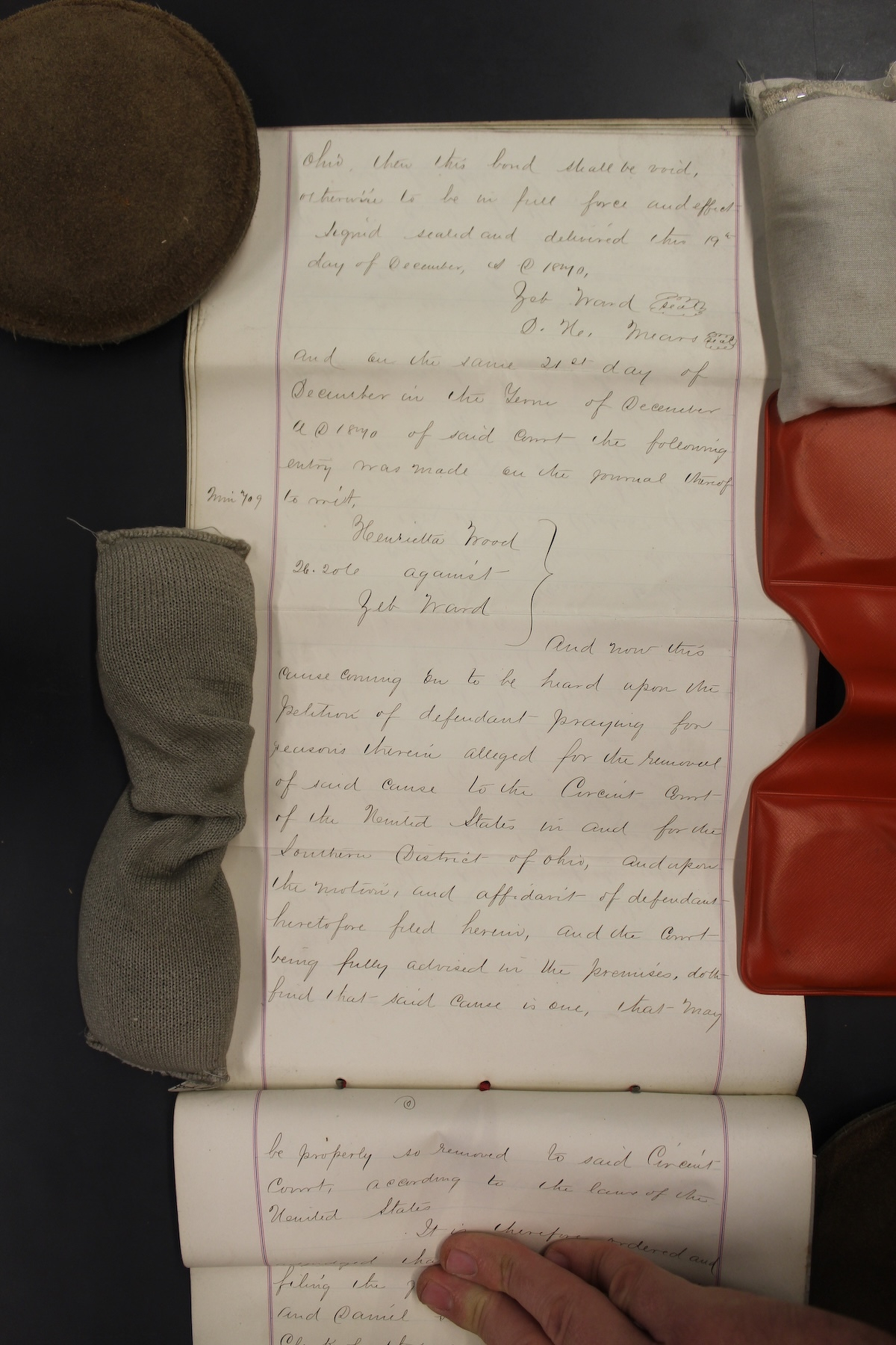 Photograph of author examining the case file of Wood v. Ward at the Chicago branch of the National Archives